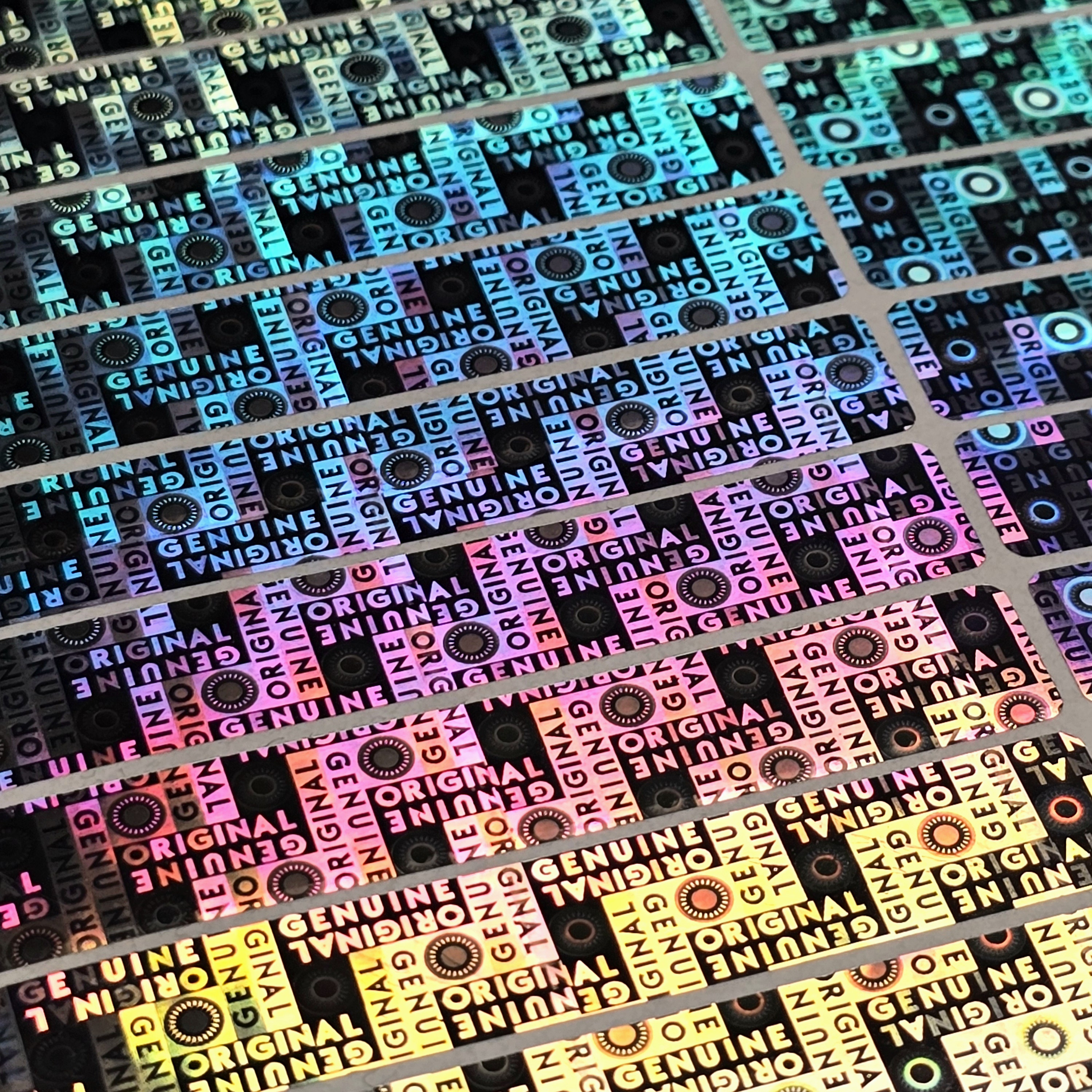 "Genuine" 3D Hologramm Sicherheitssiegel 10x60 mm Silber